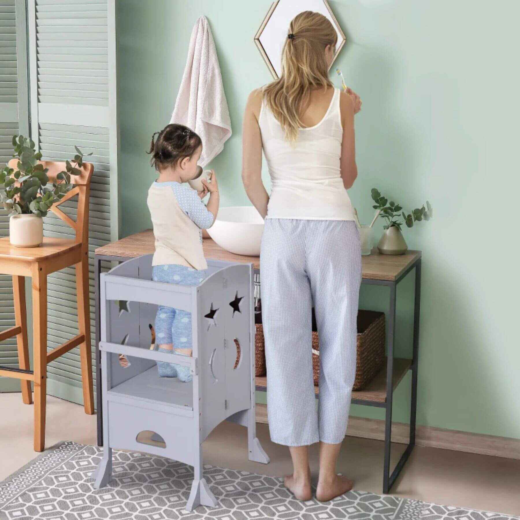 Kid Standing on Qaba Wooden Kitchen Step Stool Gray in Kitchen