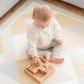 Baby Playing Tiny Land® Wooden Alphabet Blocks