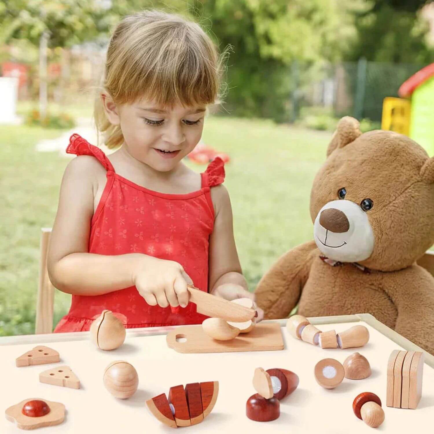 Girl Playing Tiny Land® Wooden Cut and Play Food Toys