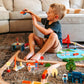 Boy Playing Tiny Land® Wooden Train Set 110 Pcs