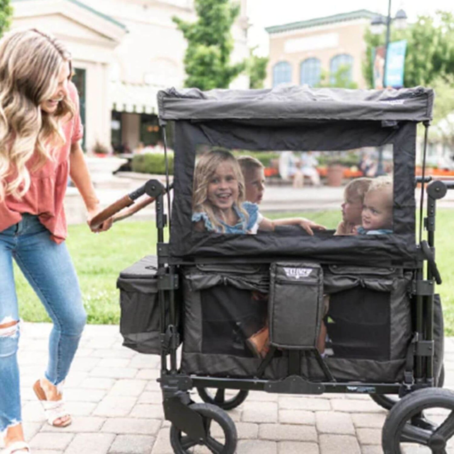 Mom Pushing Kids in Keenz XC+ - Luxury Comfort Stroller Wagon 4 Passenger Black