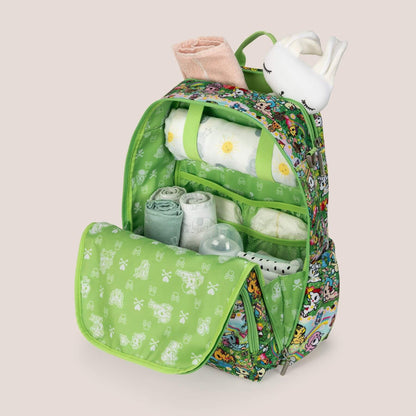 tokidoki Zealous Diaper Bag Backpack - Meadow Blooms with baby items on a beige background