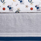 Crib sheet with animal and sports ball pattern on a textured fabric background