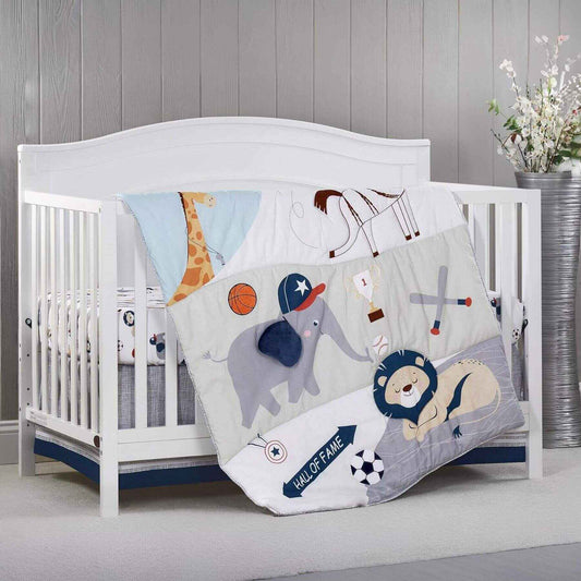 White crib with Zoo Sports 3 pc Baby Crib Nursery Bedding Set on a wooden floor.